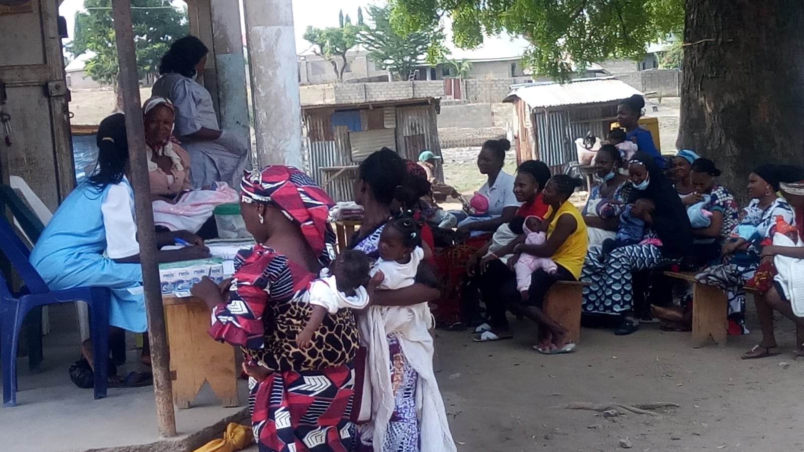 Nigerian mothers registering children at primary health center